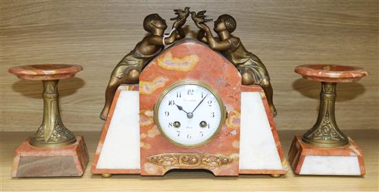 A rouge marble figurative Art Deco clock garniture clock width 30cm height 26cm